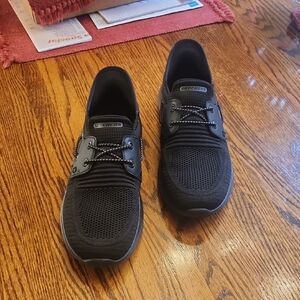 Skechers Men’s Black Knit Slip-On Casual Sneakers with Yellow Insole Accent